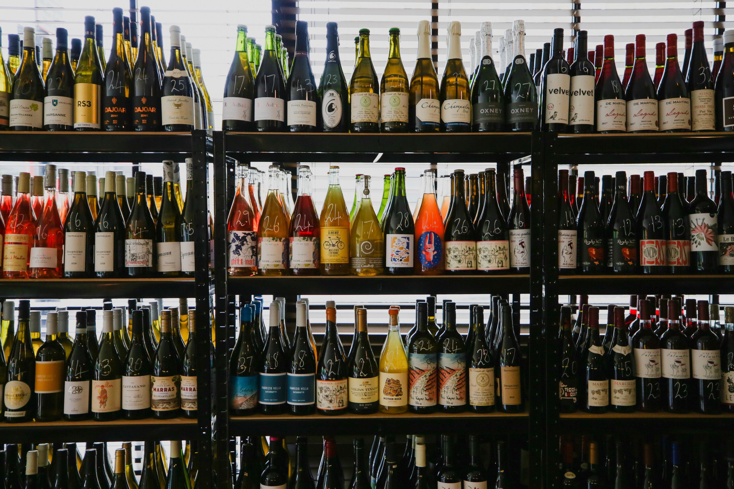 Peckham Cellars and its impressive wall of wine.