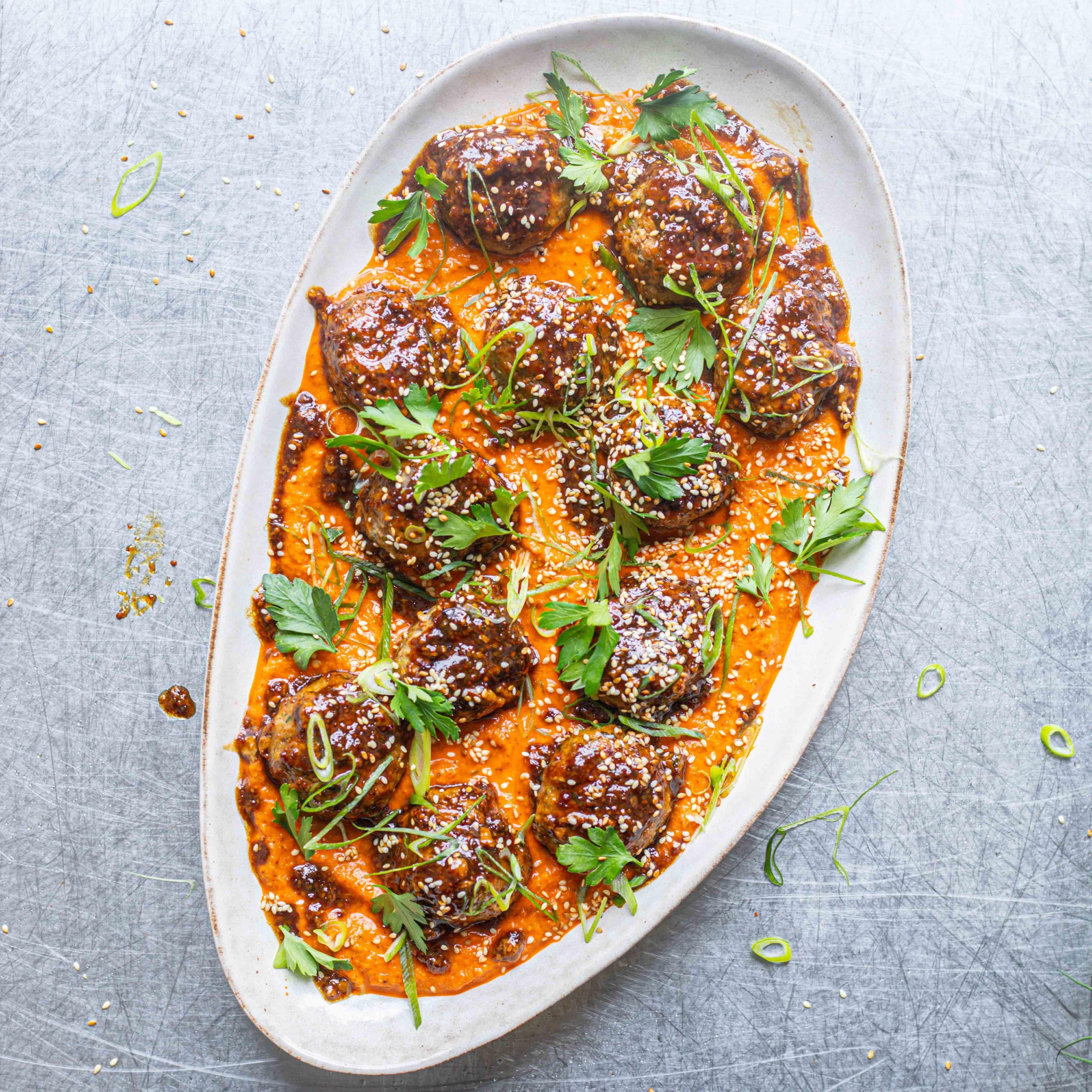 Glazed Cajun Meatballs Charred Spring Onion Romesco