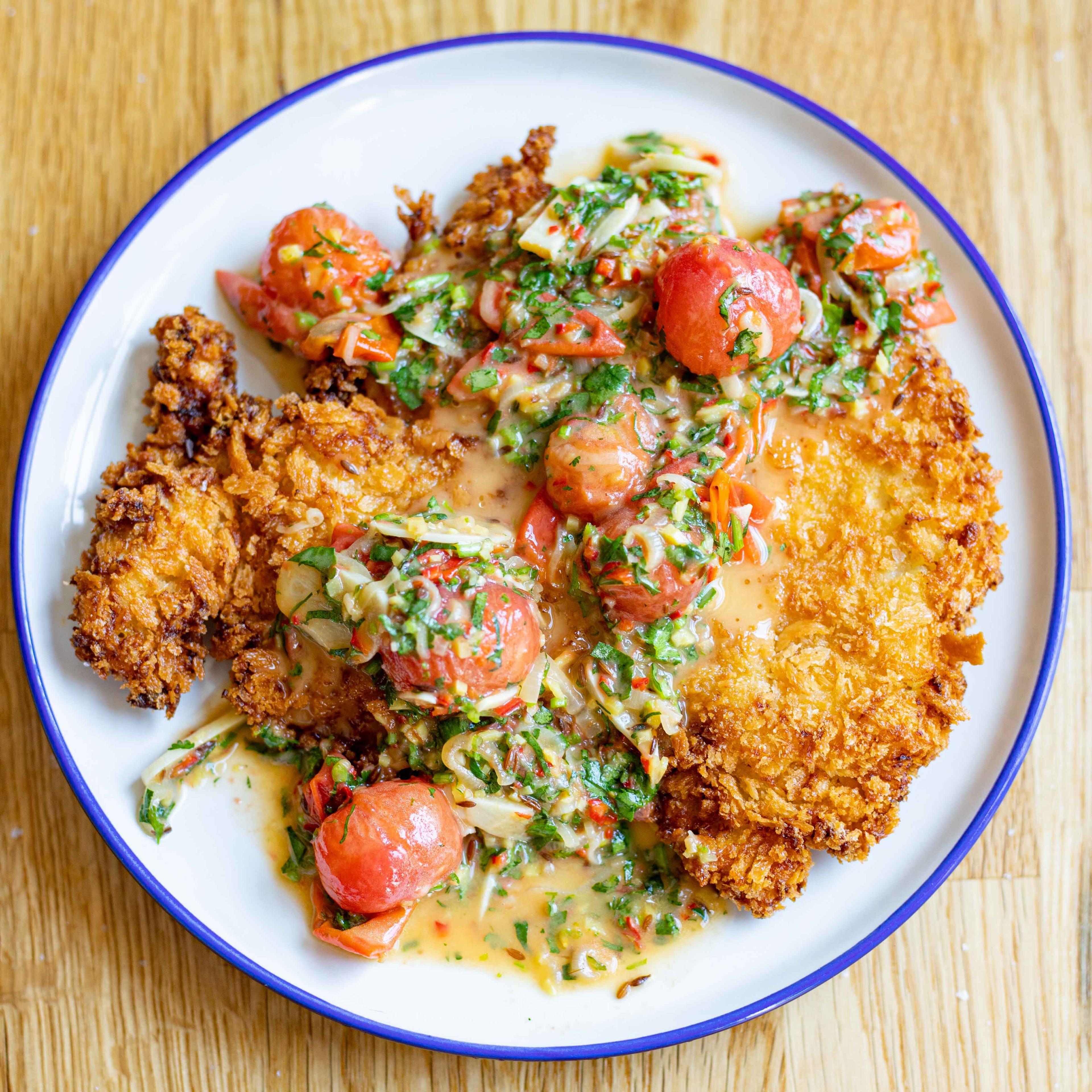 Curried Chicken Schnitzel with Burst Tomato Butter Sauce