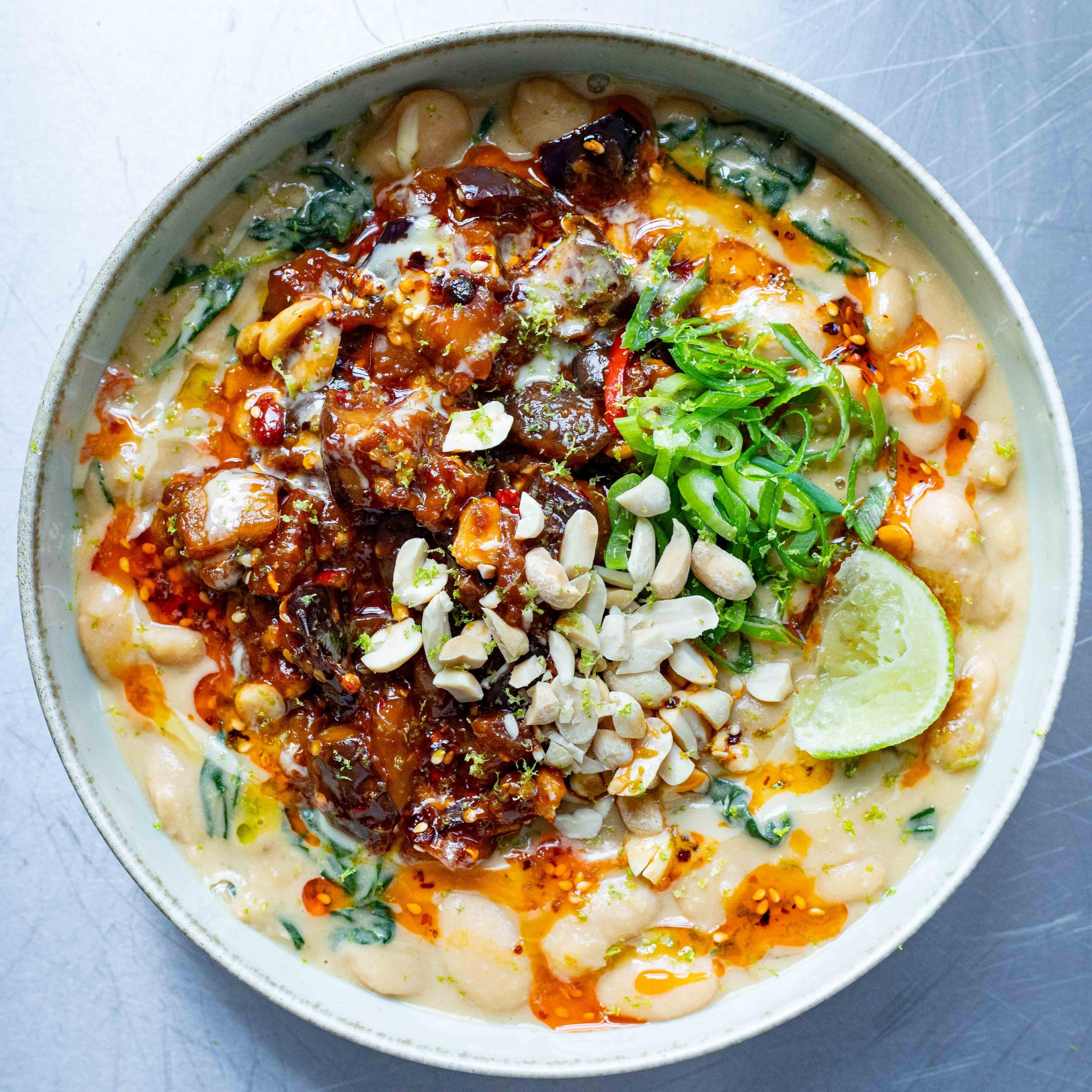 Peanut Aubergine Stir fry on Creamy Butter Beans